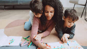 mother and young children coloring 