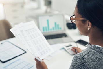 Closeup shot of an business woman calculating finances