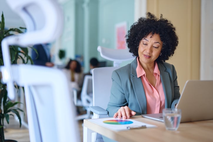 HR leader reviewing employee benefits strategy at a desk