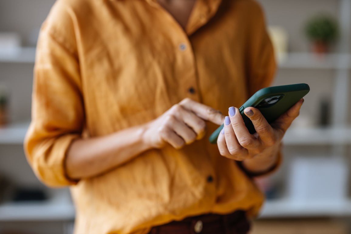 Closeup of woman looking at phone