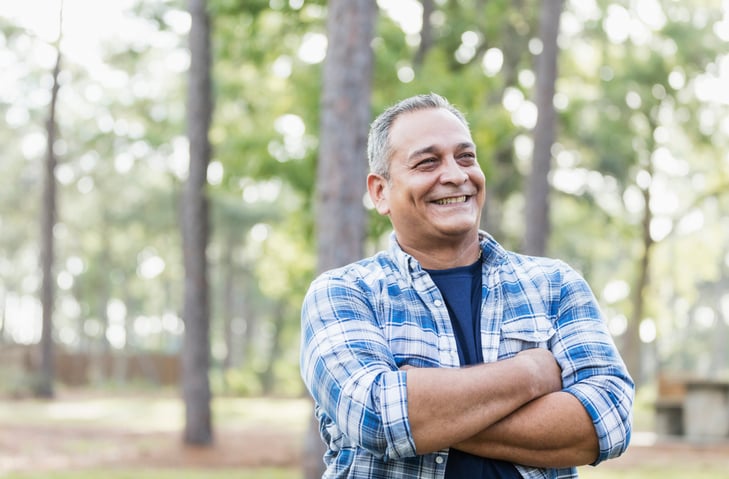 Mature Hispanic man wearing plaid shirt stock photo