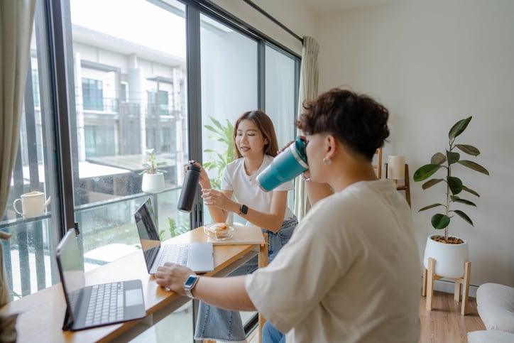 young employees talking casually while taking a break together