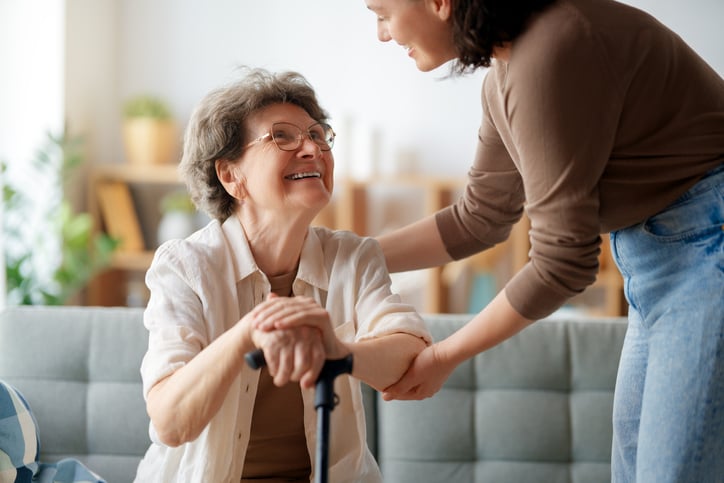 woman giving care to elder woman 