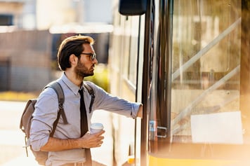 employee catching bus to work - virtual care 