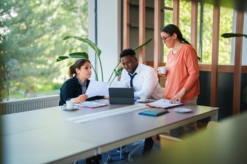 employees planning around table 