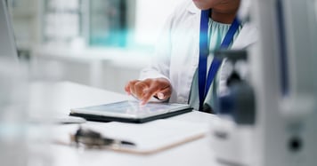 health professional using ipad 