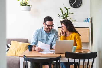 Happy couple at computer during virtual visit