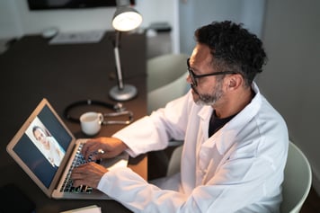 Virtual primary care doctor conducting virtual appointment