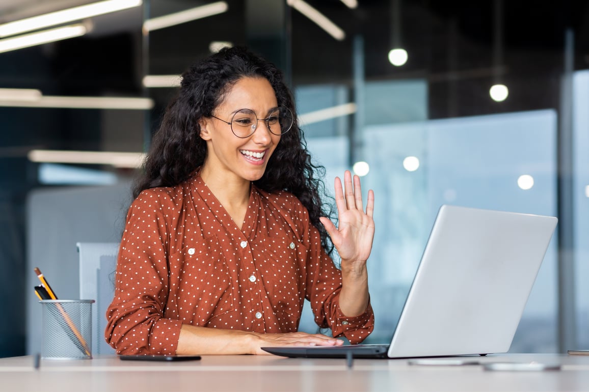 woman smiling at computer