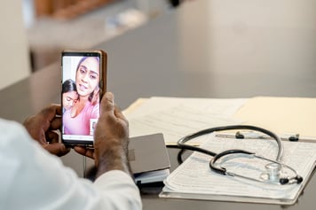 patient on video call with provider - virtual care access