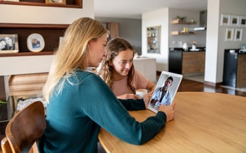 two young girls on call with virtual care provider 