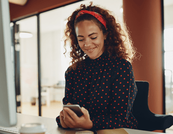 Woman smiling at phone