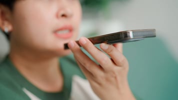 woman speaking to virtual care provider on phone 